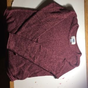A maroon/burgundy sweater
